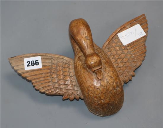 A carved wooden swan mount